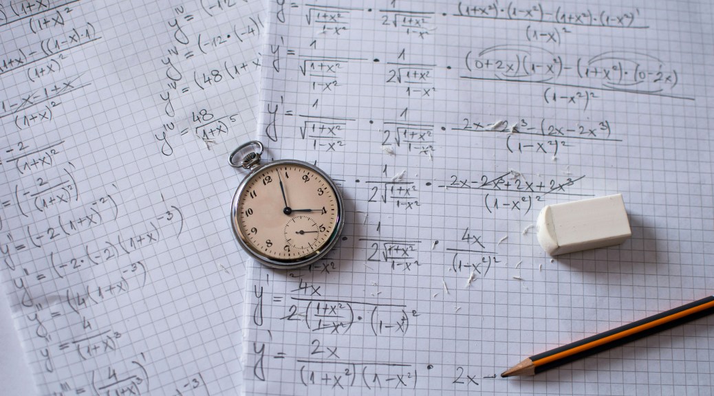 Graph paper with formulae, a stopwatch and an eraser