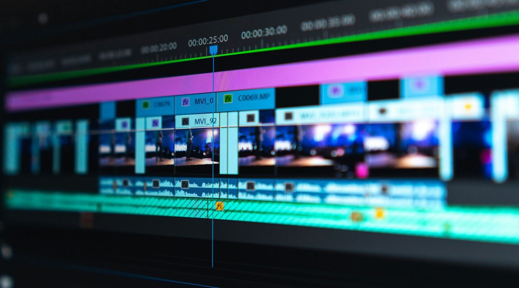 Tango videos | Photo shows an ultra-wide screen monitor with video editing software